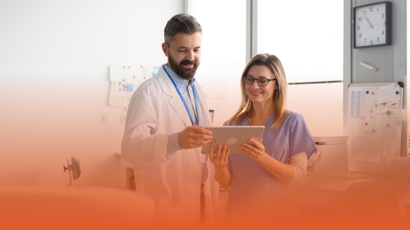 Blog banner depicting two medical professionals discussing digital patient information: used in a Densura blog on dental claims
