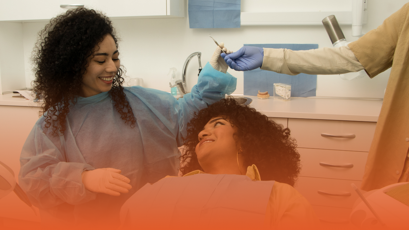 Blog banner of a smiling dentist treating a patient: used in Densura's blog about dental practice management software​.